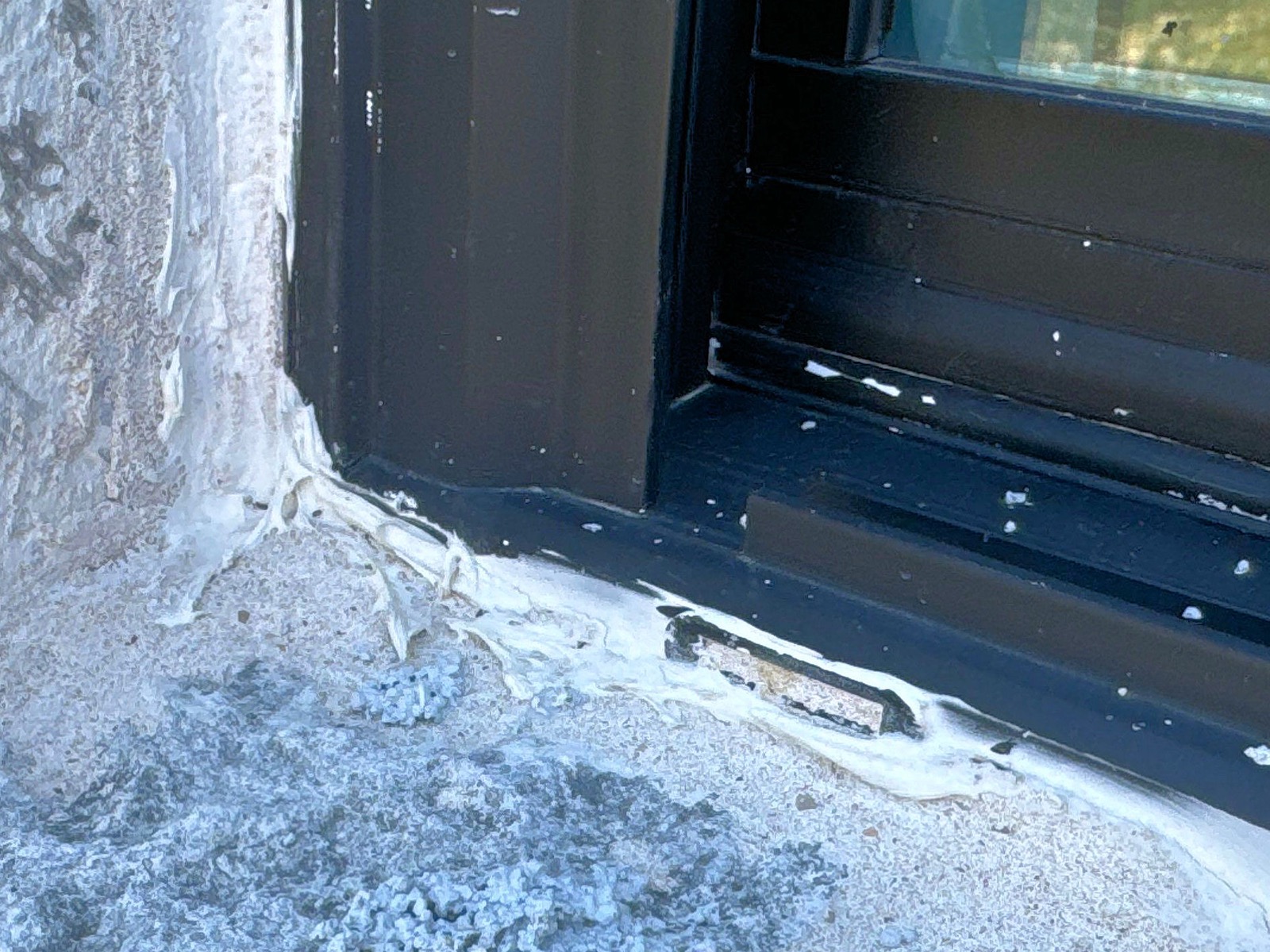 Window weep opening clogged with mortar