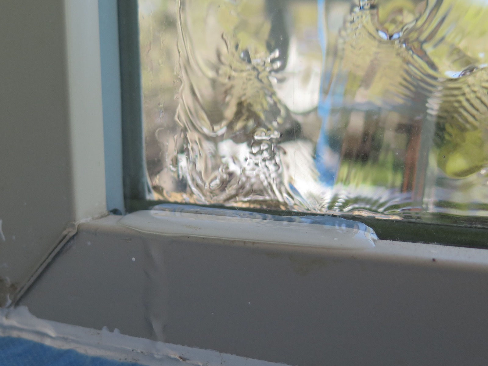 Water sheeting down over window